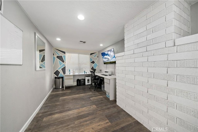 7410 Frontera Ave, Yucca Valley, CA 92284 - interior space featuring dark hardwood / wood-style flooring and brick wall