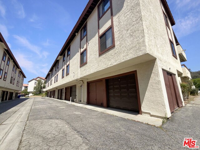 view of building exterior featuring a garage