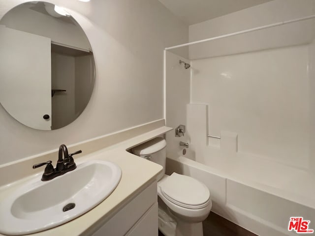 full bathroom with vanity, shower / bathtub combination, and toilet