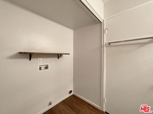 washroom featuring hookup for a washing machine and dark hardwood / wood-style floors