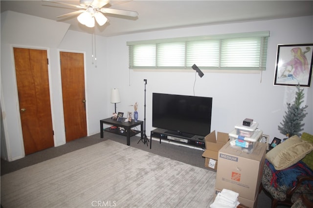 living room with carpet flooring and ceiling fan