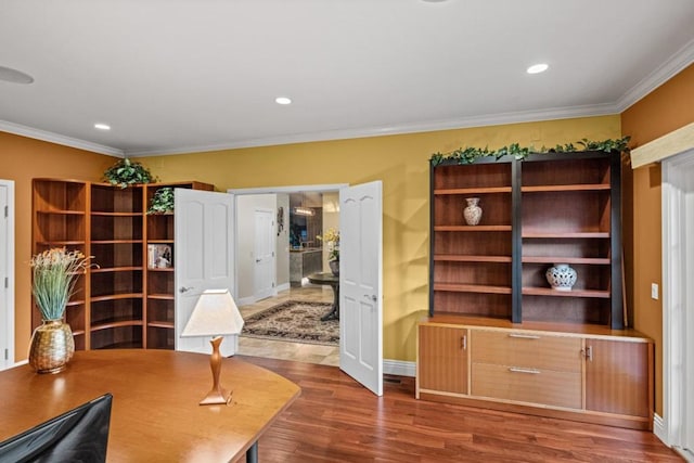 home office with dark hardwood / wood-style flooring and ornamental molding