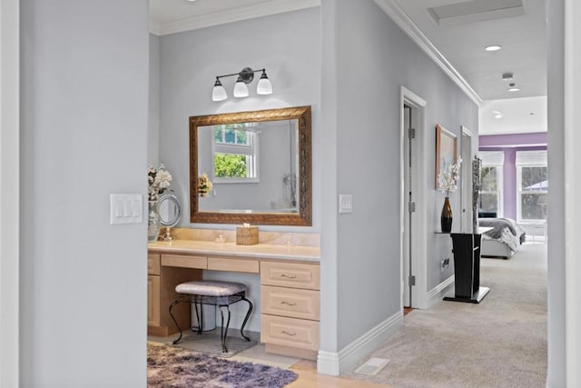 bathroom featuring vanity and ornamental molding