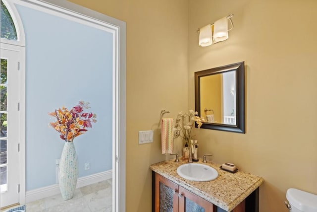 bathroom with vanity and toilet