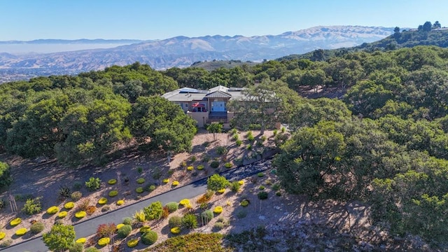 birds eye view of property with a mountain view