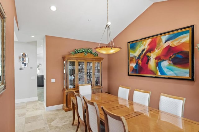 dining space with lofted ceiling