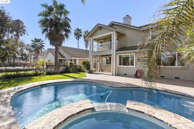 view of swimming pool with a yard and a patio