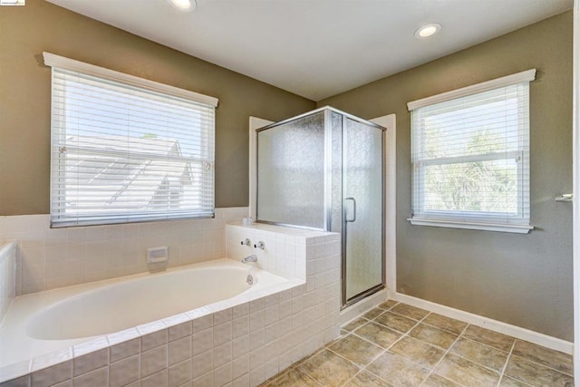 bathroom with tile patterned floors and plus walk in shower