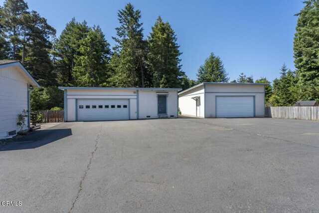 view of front of house featuring an outdoor structure and a garage