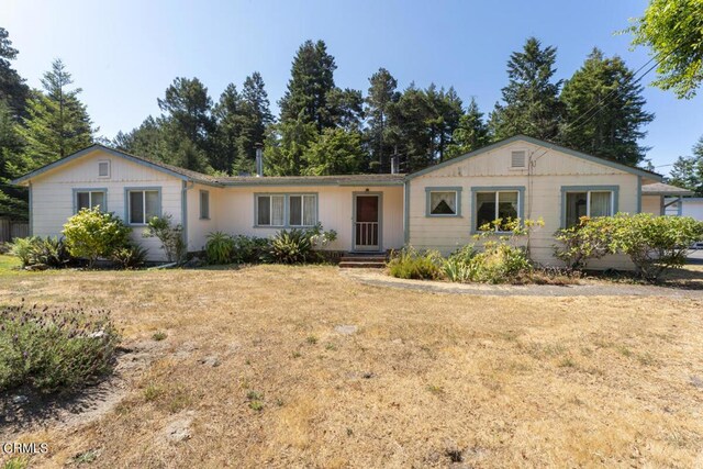 ranch-style home with a front lawn