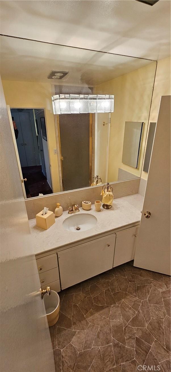 bathroom with tile patterned flooring and vanity