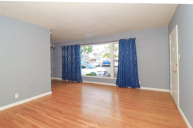 unfurnished room featuring hardwood / wood-style floors