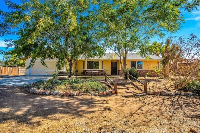 ranch-style home featuring a garage