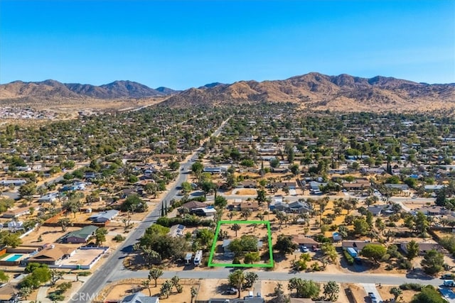 drone / aerial view featuring a mountain view