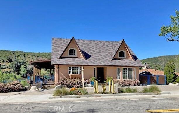 view of front of home featuring a mountain view