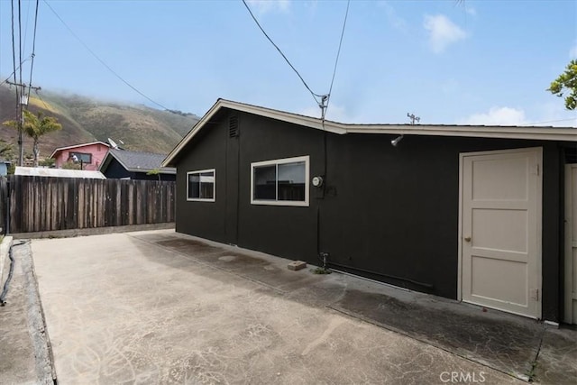 view of property exterior featuring a patio