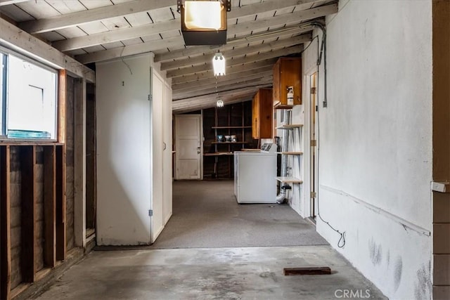 basement with wood ceiling and washer / clothes dryer