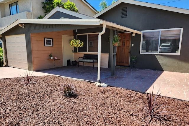 view of front of property with a carport