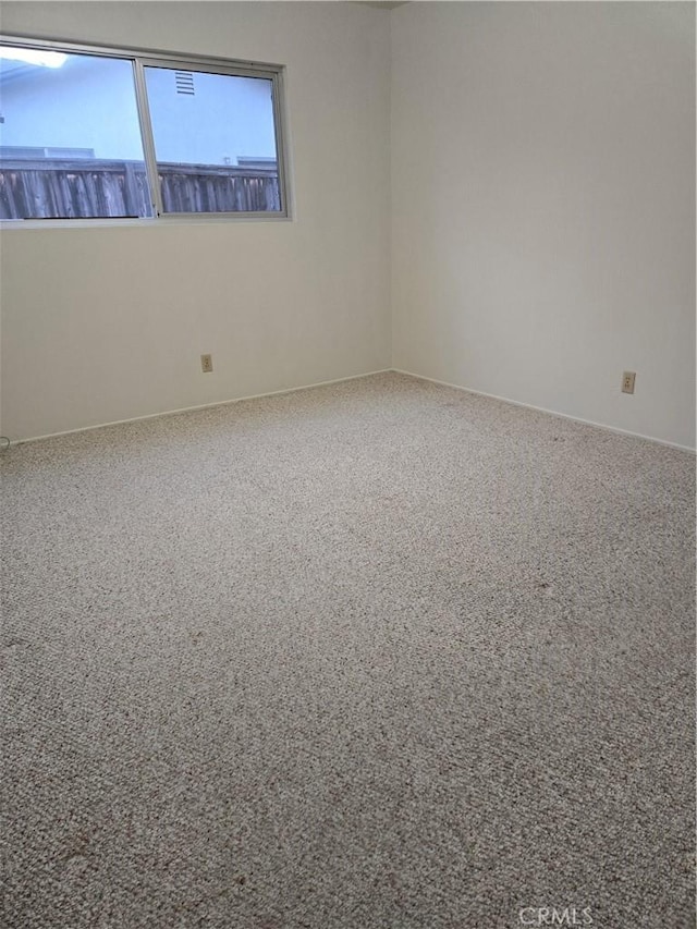 view of carpeted spare room