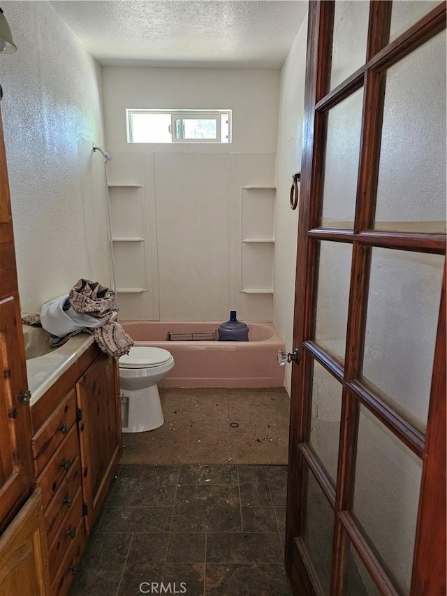 full bathroom with a textured ceiling, vanity, toilet, and shower / bathtub combination