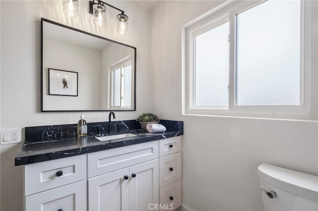 bathroom with vanity and toilet