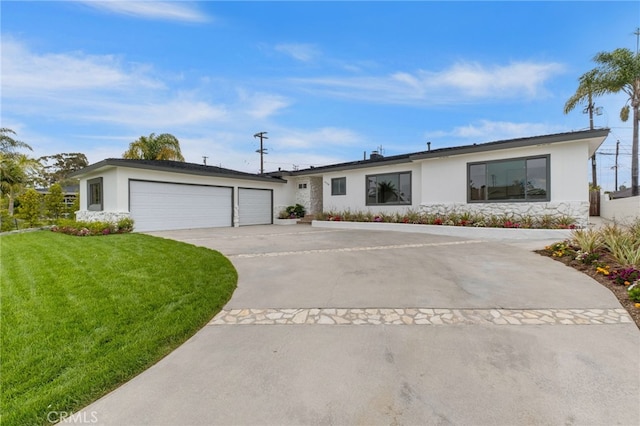 ranch-style house featuring a garage and a front yard