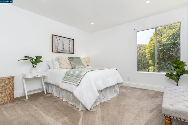 bedroom with light carpet