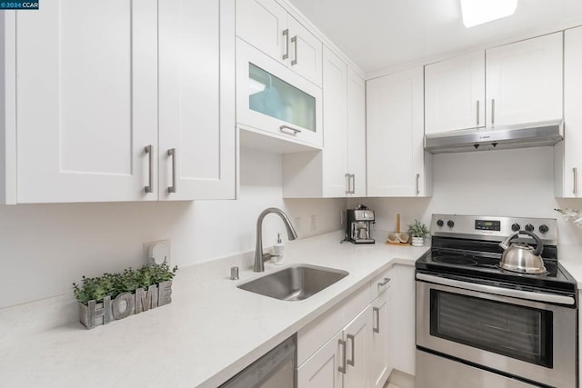 kitchen featuring stainless steel range with electric stovetop, dishwasher, white cabinets, and sink