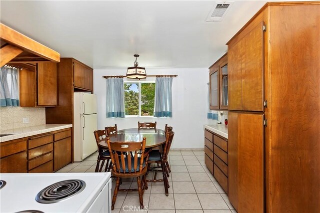 dining space with light tile patterned floors