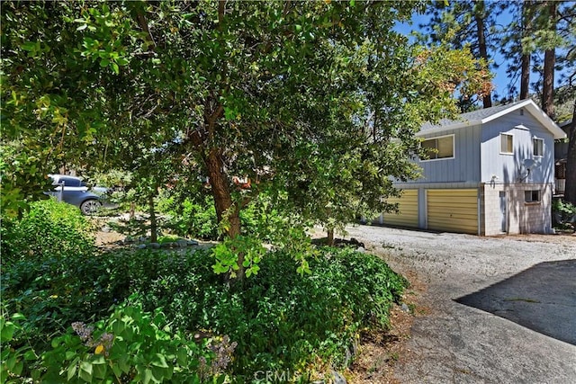 view of property exterior featuring a garage