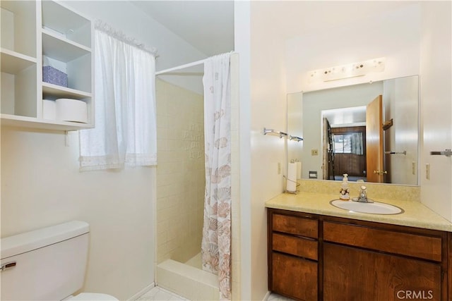 bathroom with walk in shower, vanity, and toilet