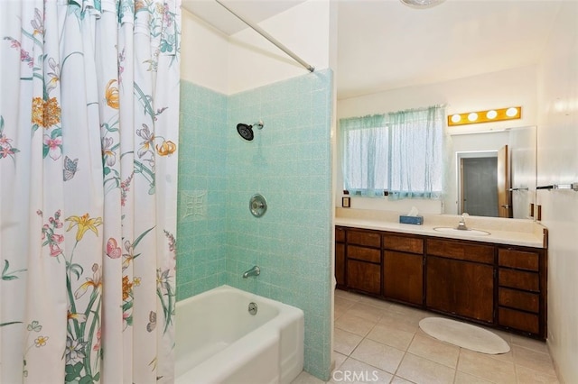 bathroom with vanity, tile patterned flooring, and shower / tub combo