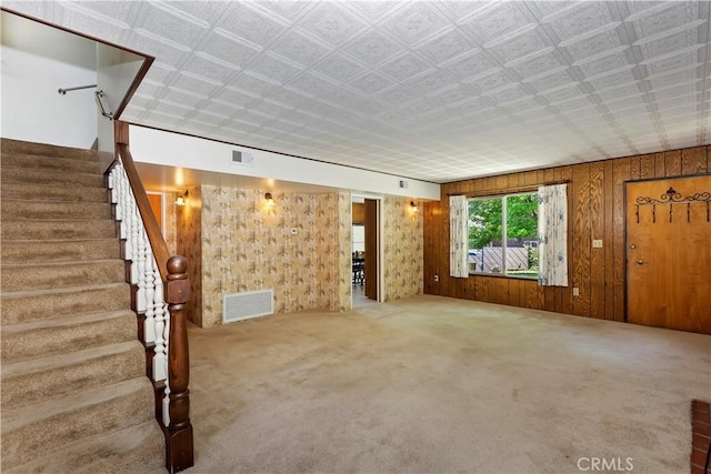 unfurnished living room featuring carpet flooring