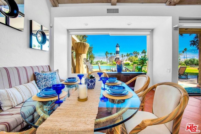 dining space with tile patterned floors and plenty of natural light