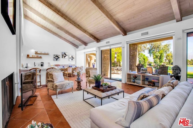 tiled living room with high vaulted ceiling, wood ceiling, and beamed ceiling