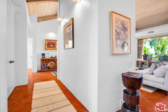 hall featuring wooden ceiling and tile patterned floors