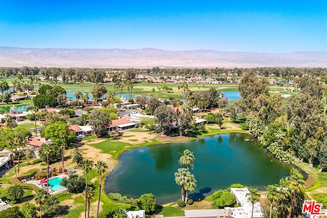 drone / aerial view featuring a water and mountain view