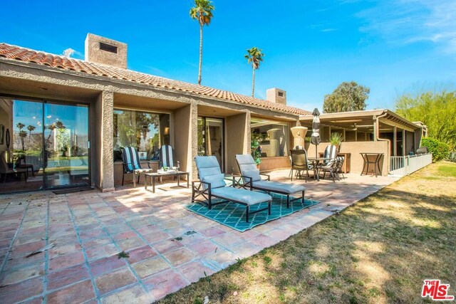 back of property featuring a patio area