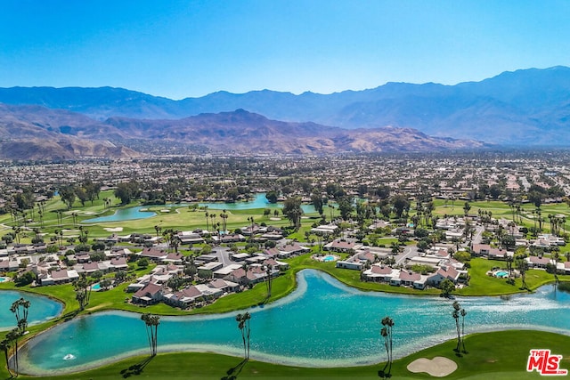 bird's eye view with a water and mountain view