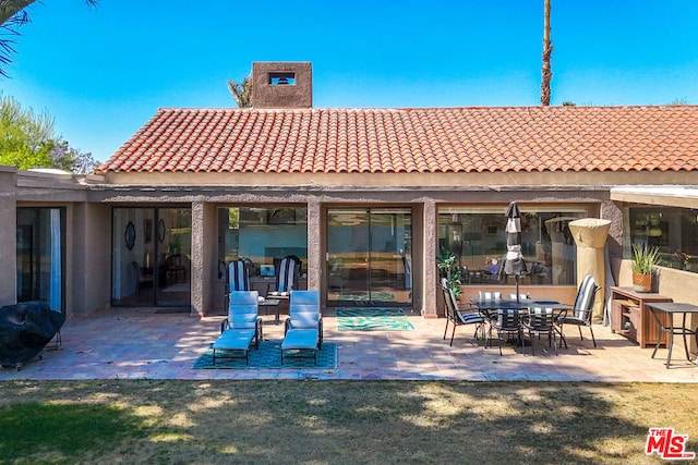 rear view of house featuring a patio