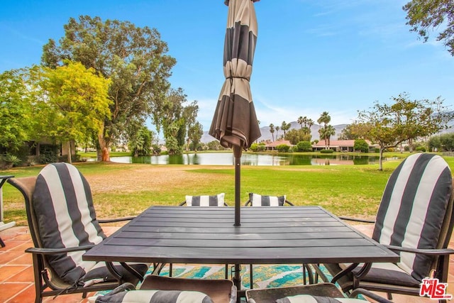 view of patio / terrace with a water view