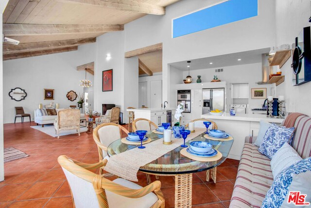 tiled dining room featuring high vaulted ceiling, wooden ceiling, a chandelier, and beamed ceiling