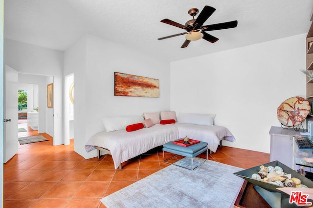 tiled living room featuring ceiling fan