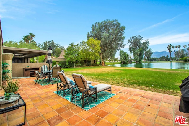 view of patio featuring a water view