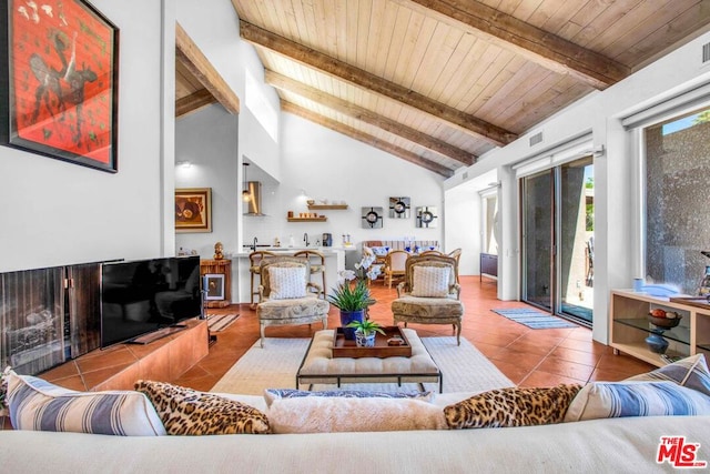 living room featuring wooden ceiling, light tile patterned floors, beam ceiling, and high vaulted ceiling