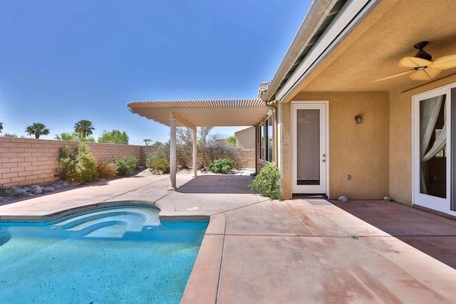 view of swimming pool featuring a patio and ceiling fan