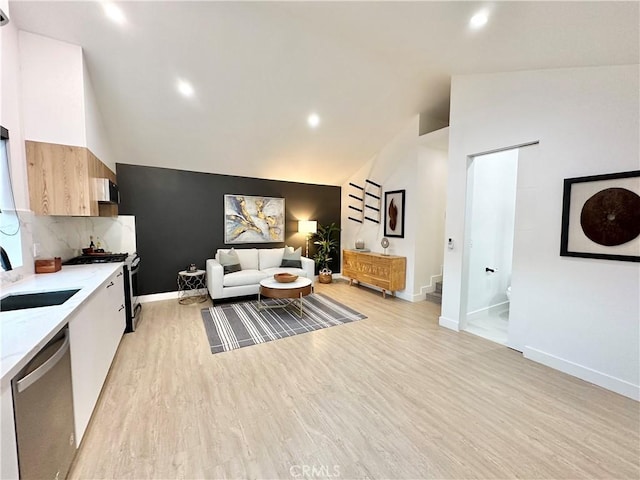 23028 W Mobile St, West Hills, CA 91307 - living room with baseboards, stairway, light wood-style flooring, and lofted ceiling