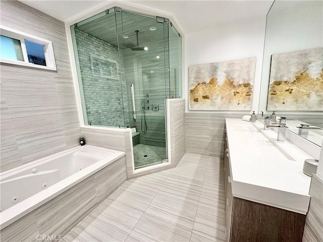 23028 W Mobile St, West Hills, CA 91307 - bathroom with tile walls, vanity, a whirlpool tub, tile patterned floors, and a stall shower
