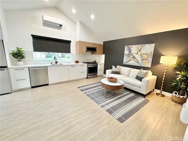 23028 W Mobile St, West Hills, CA 91307 - living area featuring recessed lighting, a wall unit AC, high vaulted ceiling, light wood-style flooring, and baseboards
