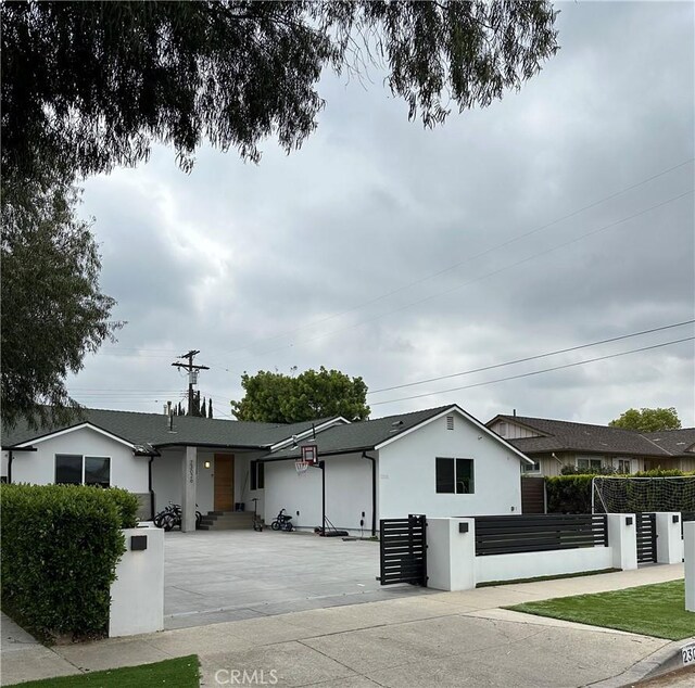 23028 W Mobile St, West Hills, CA 91307 - single story home featuring stucco siding, a gate, and a fenced front yard